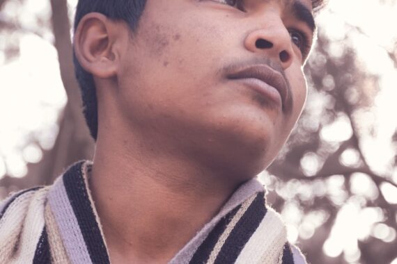 man in black and white striped shirt