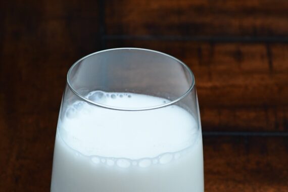 clear drinking glass with white liquid