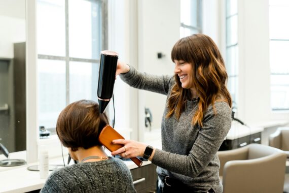 woman holding hair dryer
